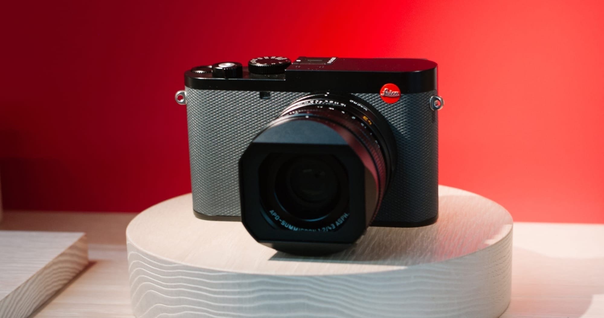 Leica Q3 43 with a red backdrop